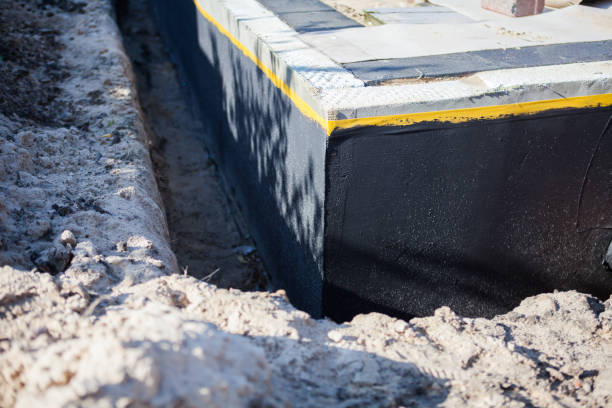 Professional Basement Waterproofing technician working in Woodstock, OH